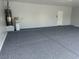 Clean garage with epoxy flooring and fixtures at 10213 Treasure Mountain Ct, Las Vegas, NV 89129