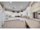 Well-equipped kitchen featuring white appliances, countertop space, and tiled floors at 10213 Treasure Mountain Ct, Las Vegas, NV 89129