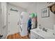 Functional laundry room with stacked washer/dryer and a utility sink at 10213 Treasure Mountain Ct, Las Vegas, NV 89129