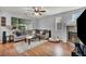 Cozy living room with a stone fireplace and comfortable seating area at 10213 Treasure Mountain Ct, Las Vegas, NV 89129
