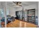 Bright home office featuring built-in shelves and hardwood flooring at 10213 Treasure Mountain Ct, Las Vegas, NV 89129