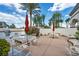 Outdoor kitchen and seating area featuring built-in grill, seating, and privacy wall at 10213 Treasure Mountain Ct, Las Vegas, NV 89129