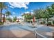 Inviting poolside patio with comfortable seating, shade umbrellas, and lush landscaping at 10213 Treasure Mountain Ct, Las Vegas, NV 89129