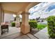 Covered porch with stylish supports and well manicured landscaping at 10213 Treasure Mountain Ct, Las Vegas, NV 89129