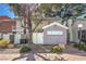Townhome backyard features xeriscaping, mature shade trees, and convenient backyard access at 1030 Tam O Shanter, Las Vegas, NV 89109