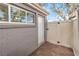 Brick paved back patio area with exterior door and wooden privacy fence at 1030 Tam O Shanter, Las Vegas, NV 89109