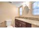 Bathroom vanity featuring granite countertops and sleek dark wood cabinetry at 1030 Tam O Shanter, Las Vegas, NV 89109