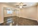 Bright bedroom with hardwood floors, mirrored closet and ceiling fan at 1030 Tam O Shanter, Las Vegas, NV 89109