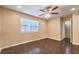 Spacious bedroom features hardwood floors, a window, and a ceiling fan at 1030 Tam O Shanter, Las Vegas, NV 89109