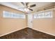 Bedroom with hardwood floors, natural light, ceiling fan, and storage at 1030 Tam O Shanter, Las Vegas, NV 89109