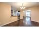 Open dining area with hardwood floors, adjacent to the kitchen, perfect for modern living at 1030 Tam O Shanter, Las Vegas, NV 89109