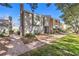 Charming townhouse featuring a brick walkway, mature trees, and well-maintained landscaping at 1030 Tam O Shanter, Las Vegas, NV 89109