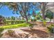 Landscaped path with mature trees and green space provides a scenic approach to this charming neighborhood at 1030 Tam O Shanter, Las Vegas, NV 89109