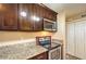 This updated kitchen features granite countertops and stainless steel appliances at 1030 Tam O Shanter, Las Vegas, NV 89109