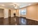 Bright main bedroom boasts hardwood floors, ceiling fan, and ensuite bathroom at 1030 Tam O Shanter, Las Vegas, NV 89109