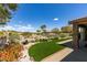 This backyard boasts artificial turf and desert landscaping, and views of the wider community at 10372 Premia Pl, Las Vegas, NV 89135