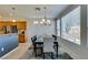 Dining area features neutral tones, natural light and transitions to the kitchen area at 10372 Premia Pl, Las Vegas, NV 89135