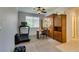 Carpeted exercise room with built-in storage, desk, and treadmill offers functionality and convenience at 10372 Premia Pl, Las Vegas, NV 89135
