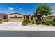 Charming single-story home featuring a two-car garage and desert landscaping at 10372 Premia Pl, Las Vegas, NV 89135