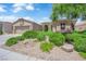 Charming single-story home with desert landscaping, stone accents, and a two-car garage at 10372 Premia Pl, Las Vegas, NV 89135