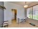Home office with desk, chair, overhead light and window with blinds at 10372 Premia Pl, Las Vegas, NV 89135