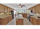 Bright kitchen with granite counters, stainless steel appliances, and a large center island at 10372 Premia Pl, Las Vegas, NV 89135