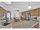 Spacious kitchen featuring granite counters, stainless steel appliances, and ample cabinet space at 10372 Premia Pl, Las Vegas, NV 89135