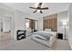 Serene main bedroom showcasing modern decor, a mirrored closet, and cozy lighting at 10372 Premia Pl, Las Vegas, NV 89135