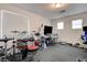 This bedroom is staged as a music room with a drum set and other electronic musical instruments at 10519 Bella Camrosa Dr, Las Vegas, NV 89141