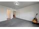 A large bedroom with a guitar and stand situated in the corner of the room at 10519 Bella Camrosa Dr, Las Vegas, NV 89141