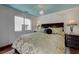 Clean shot of a comfortable bedroom featuring unique decor and hardwood floors at 10519 Bella Camrosa Dr, Las Vegas, NV 89141