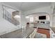Dining area showcasing staircase, living room, and elegant lighting at 10519 Bella Camrosa Dr, Las Vegas, NV 89141