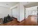 Upstairs hallway with hardwood floors and exercise equipment visible in the open room at 10519 Bella Camrosa Dr, Las Vegas, NV 89141