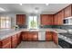 Kitchen with granite countertops, stainless appliances, and sleek cabinetry at 10519 Bella Camrosa Dr, Las Vegas, NV 89141
