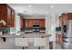 The kitchen offers bar seating, granite counters, and stainless steel appliances at 10519 Bella Camrosa Dr, Las Vegas, NV 89141