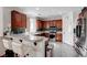 Eat-in kitchen with granite countertops, breakfast bar, and stainless steel appliances at 10519 Bella Camrosa Dr, Las Vegas, NV 89141