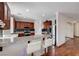 Kitchen featuring stainless steel appliances, dark wood cabinetry, and granite countertops at 10519 Bella Camrosa Dr, Las Vegas, NV 89141