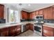 Well-lit kitchen with stainless steel appliances and granite countertops, showcasing a modern cooking space at 10519 Bella Camrosa Dr, Las Vegas, NV 89141