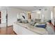Bright, open-concept living room with hardwood floors and an adjoining dining area at 10519 Bella Camrosa Dr, Las Vegas, NV 89141