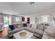 Open living room showcases comfortable seating, stylish decor, and access to a backyard pool at 10519 Bella Camrosa Dr, Las Vegas, NV 89141