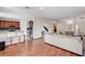 Open-concept view of the kitchen with bar seating flowing into the living room at 10519 Bella Camrosa Dr, Las Vegas, NV 89141