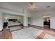 Luxurious primary bedroom featuring hardwood floors, access to ensuite bathroom and connecting bedroom at 10519 Bella Camrosa Dr, Las Vegas, NV 89141