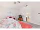 Bright bedroom with a large window, a TV, and access to the ensuite bathroom at 1084 Little House Ct, Henderson, NV 89011