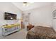 Cozy bedroom with a twin bed, a yellow desk, and a window with curtains at 1084 Little House Ct, Henderson, NV 89011