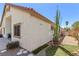 Exterior view of home showing the side of the house with a tile roof and desert landscaping at 1084 Little House Ct, Henderson, NV 89011