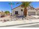 Charming single-story home with desert landscaping and mature palm tree at 1084 Little House Ct, Henderson, NV 89011