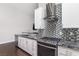 Stylish kitchen showcasing granite countertops, stainless steel appliances and mosaic backsplash at 1084 Little House Ct, Henderson, NV 89011
