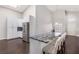 Kitchen with white cabinets, a granite countertop, and seating for dining at 1084 Little House Ct, Henderson, NV 89011
