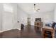 Bright living room with high ceilings, dark hardwood floors and ample natural light at 1084 Little House Ct, Henderson, NV 89011
