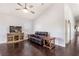 Spacious living room featuring dark hardwood floors and neutral colored walls at 1084 Little House Ct, Henderson, NV 89011